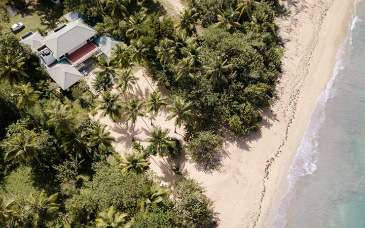 Aerial view of house and beach at Casa Paraíso