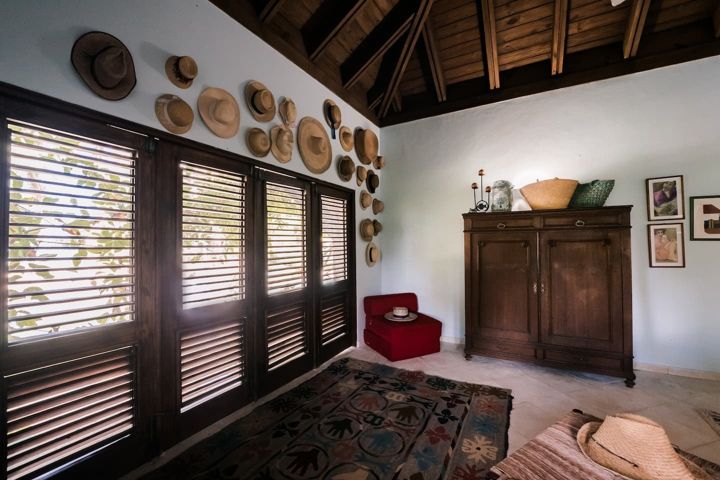 Bedroom with shuttered windows at Casa Paraíso